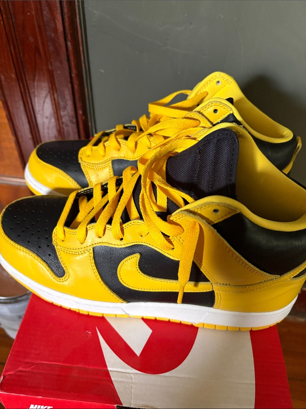 Nike Black and Yellow High-Top Dunk Sneakers.